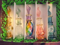 A box of 5 Egyptian imported handmade glass perfume bottles with various bottle decorations to choose from. Each small bottle has a capacity of 5g.