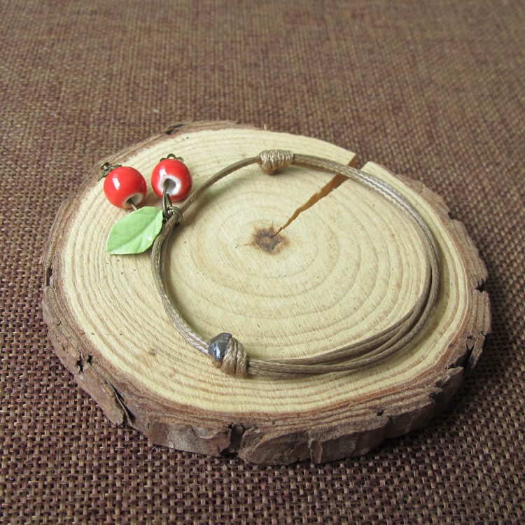 Phiên bản Hàn Quốc của thời trang vòng tay gốm cherry nữ quà tặng sinh viên ngọt ngào Jingdezhen trang sức gốm một nhân dân tệ vòng tay cao su