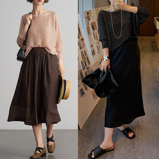 Anna Is a Social Media Sensation, and Her Gold and Silver Thread Linen Batwing Sleeve Off-Shoulder Knit Top Is an Elegant Three-Quarter Sleeve Blouse