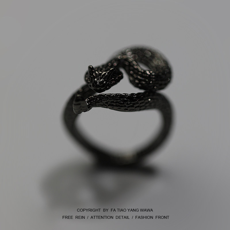 Clockwork gets bored and wears a rattlesnake dark black ring.