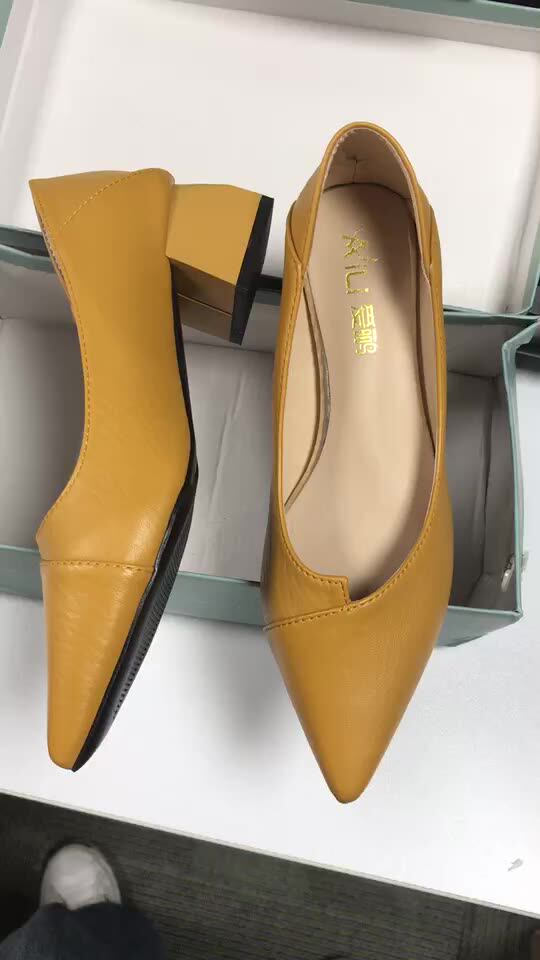 pointed yellow heels