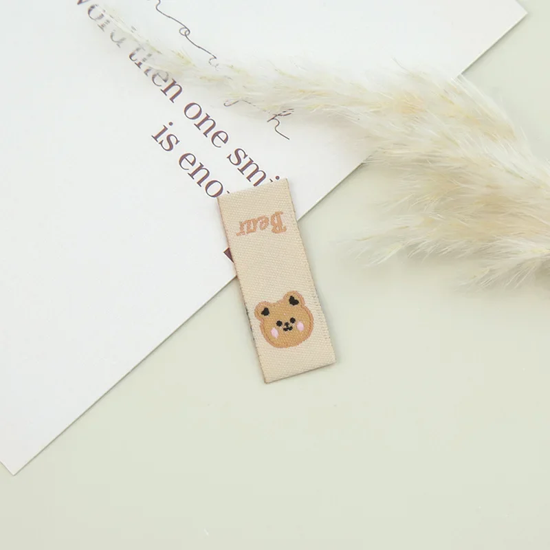 Cartoon weaving mark fabric label bear cloth standard accessories manual weaving mark back standard hair rope hair ring accessories manufacturers direct supply