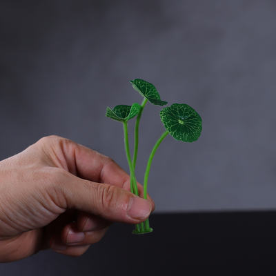 A plastic artificial flower vase imitating pennywort for decorating green plants