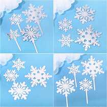 Snowflake acrylic Christmastime snowflake white silver cake decoration inserted in a sweet taster to decorate ice and snow