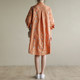 Naturally produced loose casual embroidered A-line version of vibrant orange young mid-length shirt dress QA2113