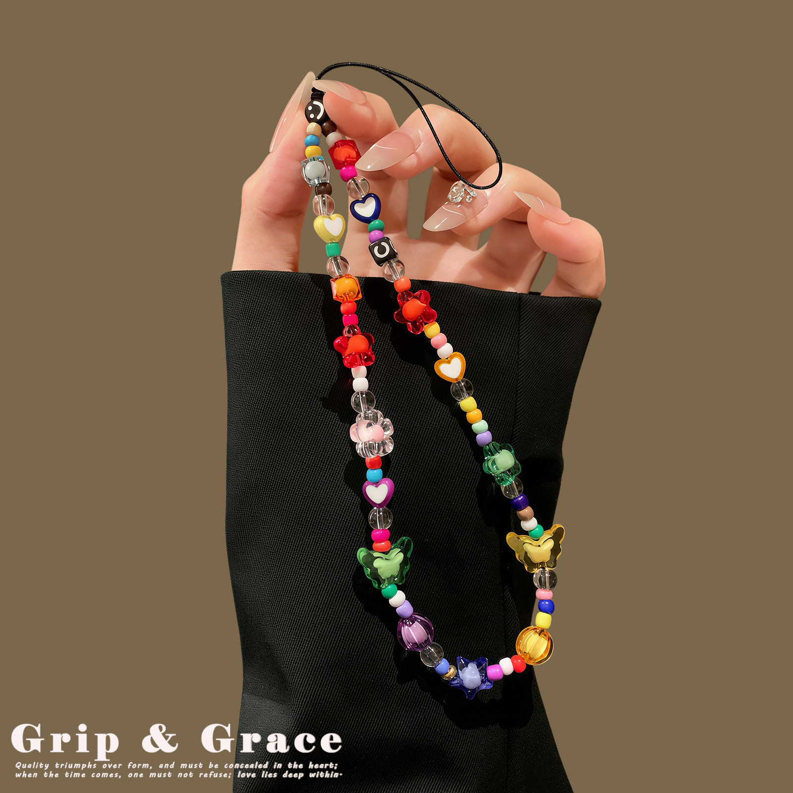 GripGrace premium beaded wrist chain with a sweet and cool crystal phone charm, keychain, and sparkly bag charm.