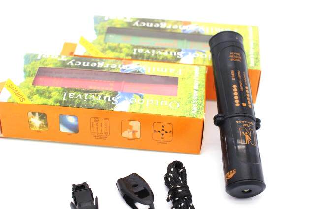 The Survivor beats the fire bar ten to fight the flint outdoor LED lamp for the survival whistle to take the fire stick compass
