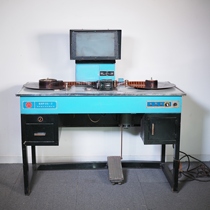 Normally functioning domestic antique old-fashioned desktop 35mm film inspection and rewinding table viewer and rewinder