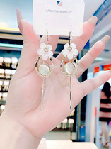 Super fairy sterling silver needle personality Cats Eye Stone long temperament earrings senior sense flower tassel new net red earrings women