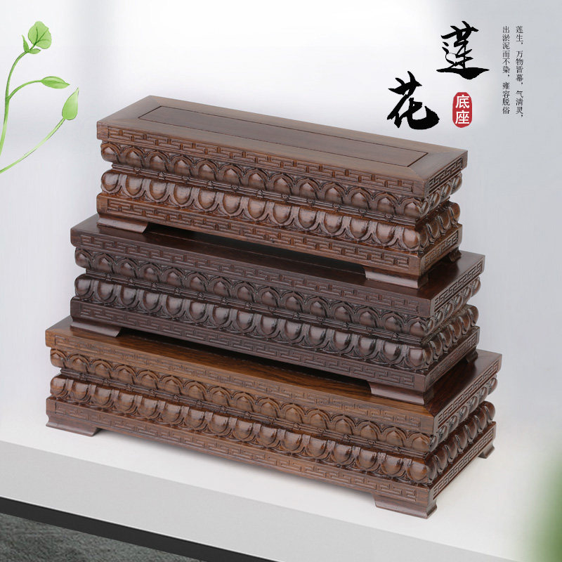 The statue of black sandalwood statue is decorated with the china - wood carving process gift decorated with the chi - stone basin frame of solid wood lotus base