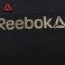 Reebok Reebok Thể thao chính thức Thể dục Phụ nữ Đào tạo Áo thun ngắn tay áo dài Fuj31 - Áo phông thể thao