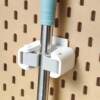 Mop broom storage hole plate