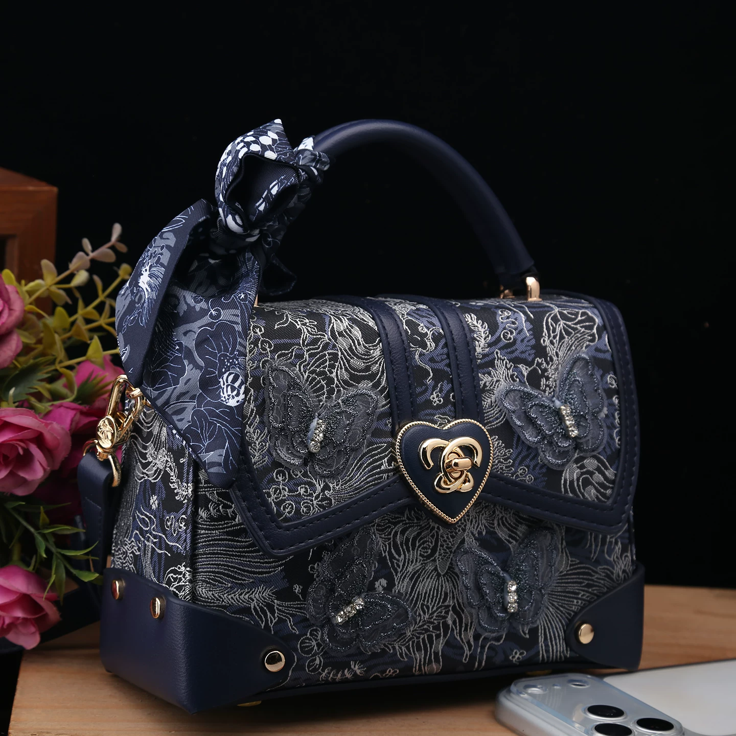 Handheld bag, genuine leather, with embroidery