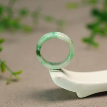 White background floating green burmese natural grade a jadeite ring