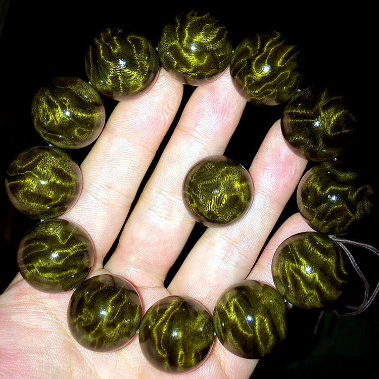 Shady gold silk Numu wood dragon emboldened wave handstring male and female Buddha beads hand over golden silk waterpolo cat eye