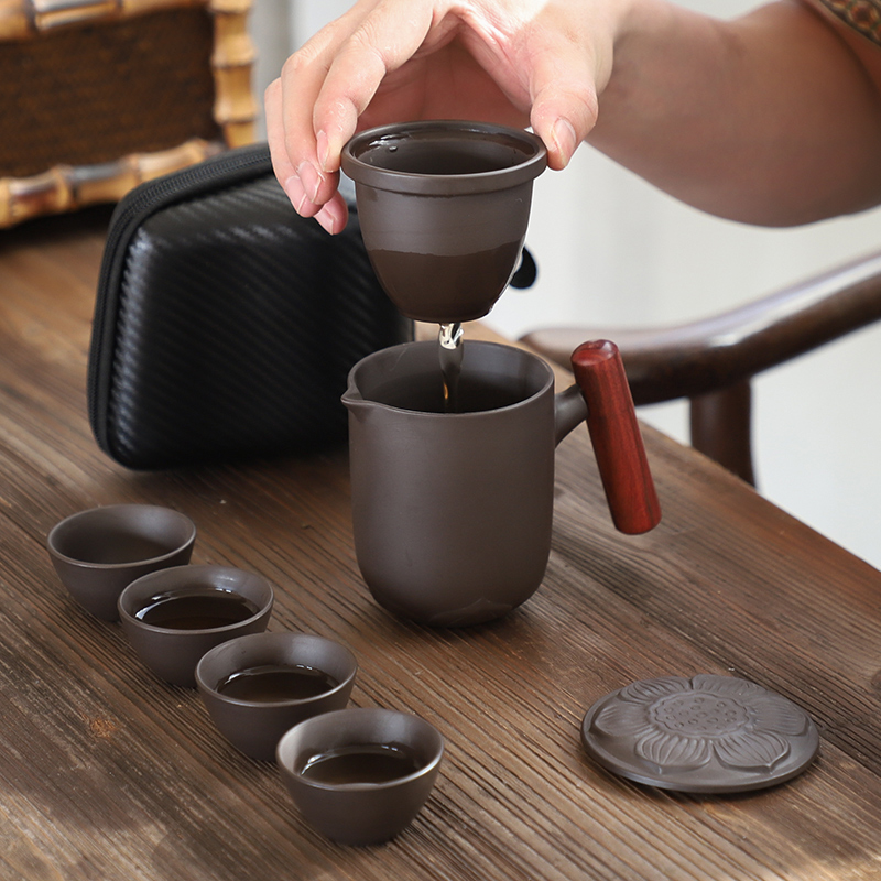 Portable kung fu tea set a pot of four cups of ceramic household violet arenaceous crack cup car travel is suing the tea set