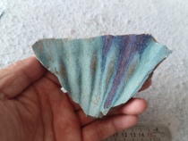 A large Jun porcelain bowl with a flower mouth during the Song and Yuan Dynasties. It is relatively large in size. It has red spots. It is relatively beautiful. It flows like clouds and water.