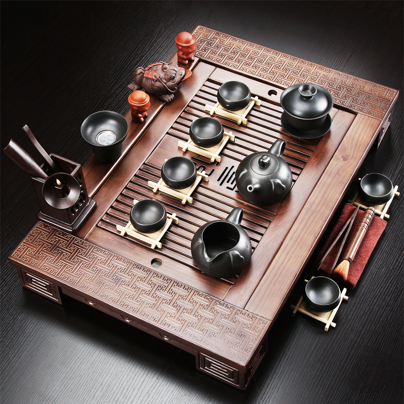 A complete set of purple sand tea set solid wood tea tray tea home office ceramic kung fu tea set the teapot tea accessories