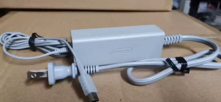 Game console, genuine power supply, power adapters