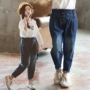 Cô gái béo mùa thu 2018 mới diện quần jeans trẻ em phiên bản Hàn Quốc của quần lửng ống rộng giản dị quần jean lưng thun cho bé