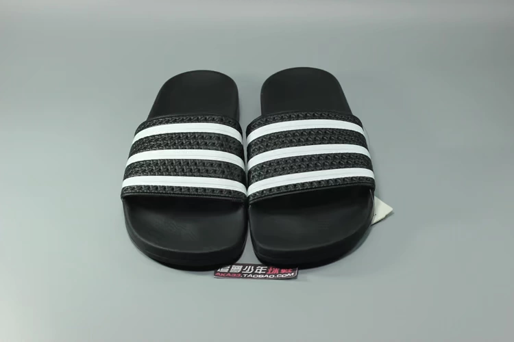 ADIDAS clover ADILETTE sọc đen và trắng thể thao bãi biển cuộc sống 280647 AP9971 - Dép thể thao