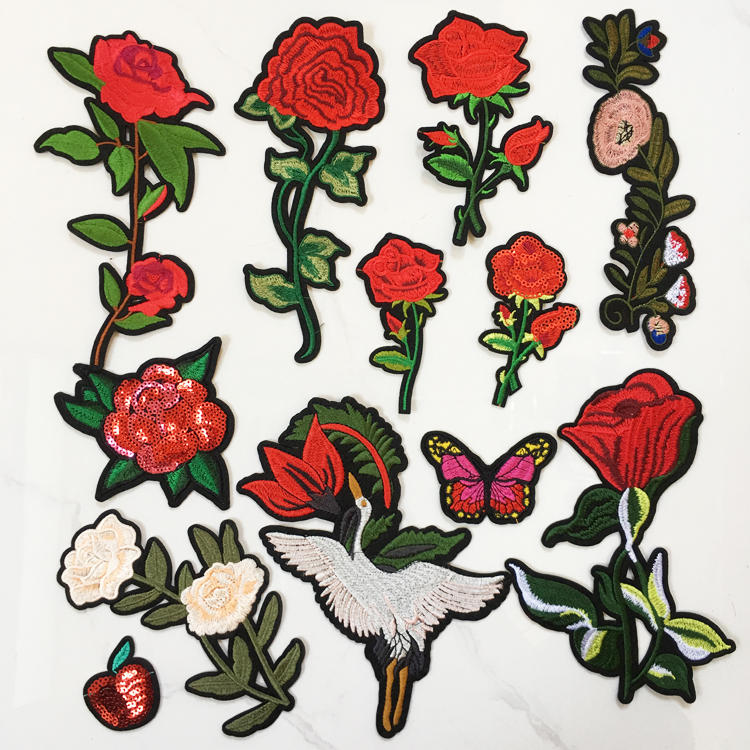 Large red embroidered rose blob with clothes cloth stuck to the hole and a flower pattern embroidered patch to subsidize the small filling hole