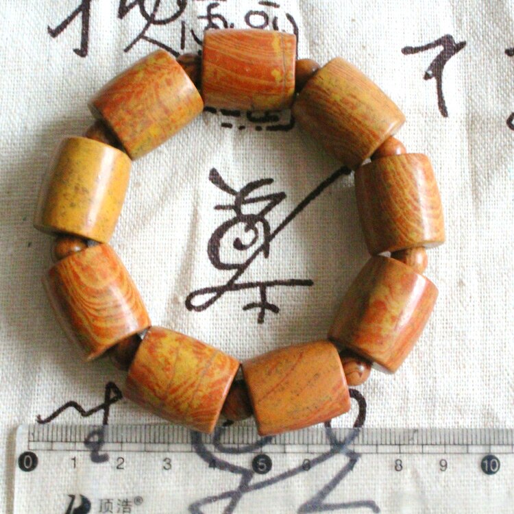 Surabaya rich red large Bianstone tongluo hand string stone drum shape diamond Sutra to attract wealth