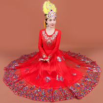 La nouvelle danse du Xinjiang joue avec le style féminin de style à demi-corps habié en perles Uyghur une jupe de balançoire à vent ethnique de type Uyghur