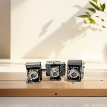 Among the three defective products ancient objects small leather chambers cameras pocket machines ornaments cafe model room soft furnishings