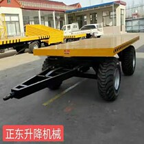 Hot selling electric flat car grassland traction flat car warehouse trailer four-wheel mobile unloading table cargo truck