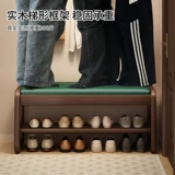 Столетная замена обуви с твердым деревом у двери домашнего пользователя может сесть и носить обувные табуретки.