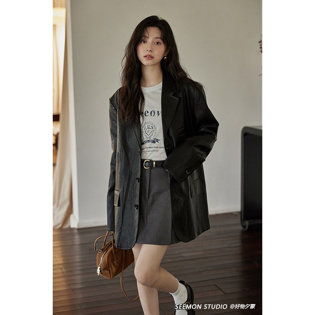 Ximeng Spring and Autumn black American retro mid-length mini-length ເສື້ອຫນັງ niche ການອອກແບບສໍາລັບແມ່ຍິງ