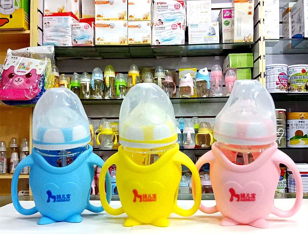 Children's wide mouth penguin-shaped silicone sleeve crystal drill glass feeding bottle with handle and straw feeding bottle
