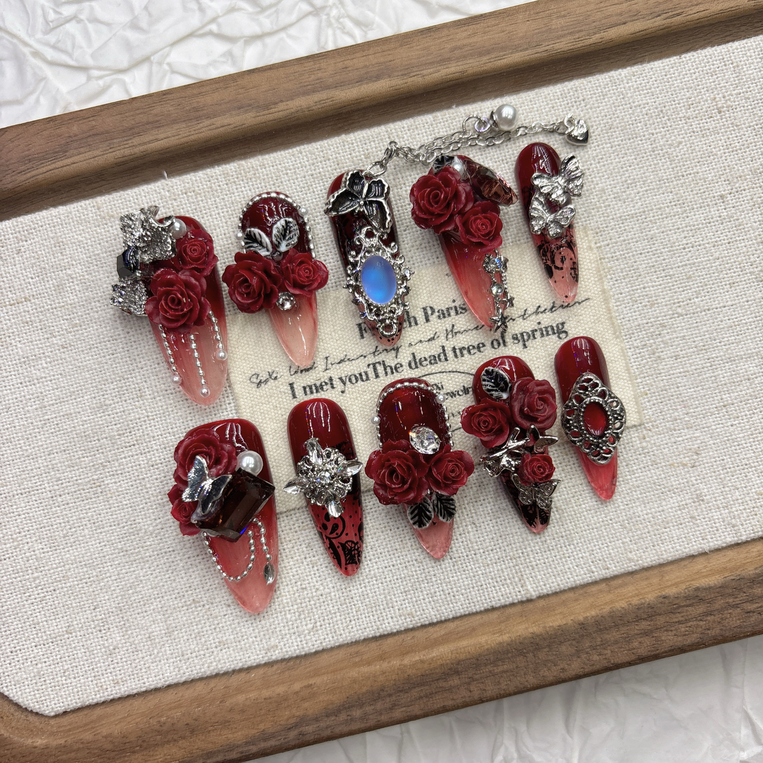 Dark red rose pure hand-worn nail, high-end feeling, cool and handsome nail art 2026 New Year's new product medium and long pointed model — wholesale press on nails detail view 2
