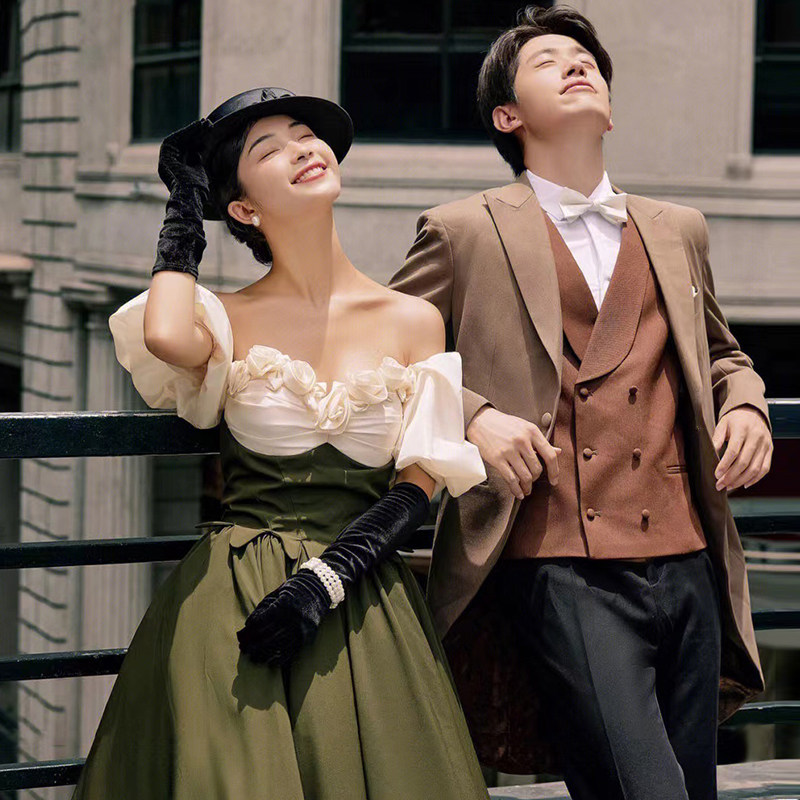 Studio theme clothing photography retro street photography French wedding couple photo shoot dark green one-shoulder dress