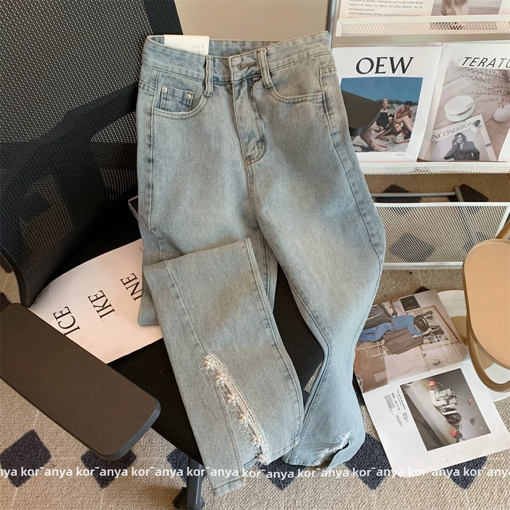 Женские джинсы с заниженной талией и расклешенной бахромой вSpring-Summer, с фронтальным разрезом, крупной стежкой и необработанными краями, обтяжка и эластичность