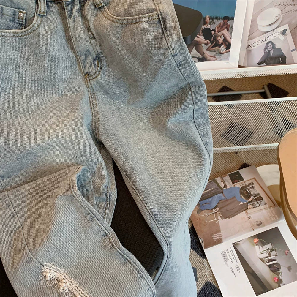 Женские джинсы с заниженной талией и расклешенной бахромой вSpring-Summer, с фронтальным разрезом, крупной стежкой и необработанными краями, обтяжка и эластичность