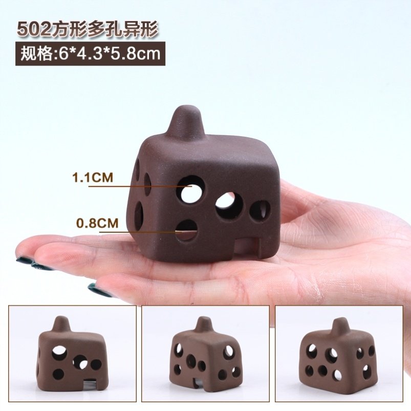 Arranged accessories small fish shelter from the house spawning cave tile background Interiors small cleaning Small size scenery porous build view