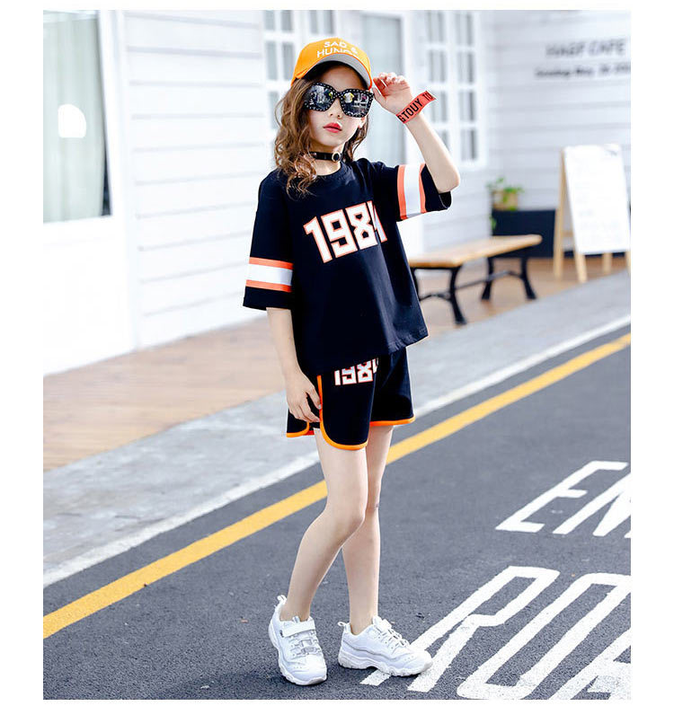 Bộ đồ bé gái giản dị 2018 hè mới phiên bản Hàn Quốc của các chàng trai bảnh bao, quần lửng tay lửng ngắn hai dây thể thao quần jean trẻ em