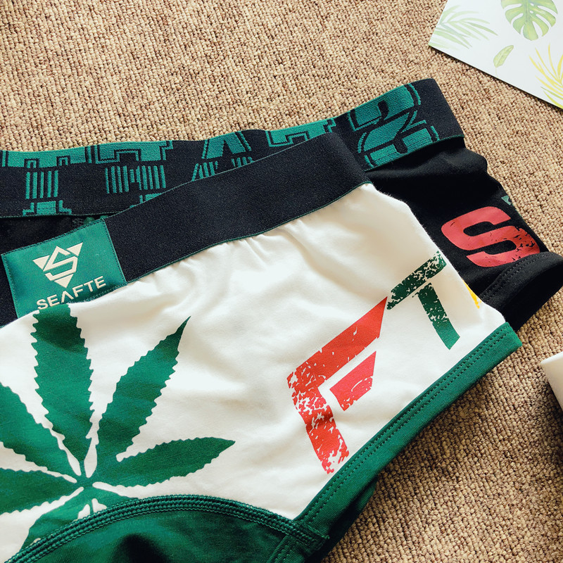 Chất liệu cotton nam Boxer Tóm tắt Thanh niên Cotton Cá tính Maple Leaf Quần short gợi cảm Đầu thấp Quần bó Quần thể thao quan lot khe nam
