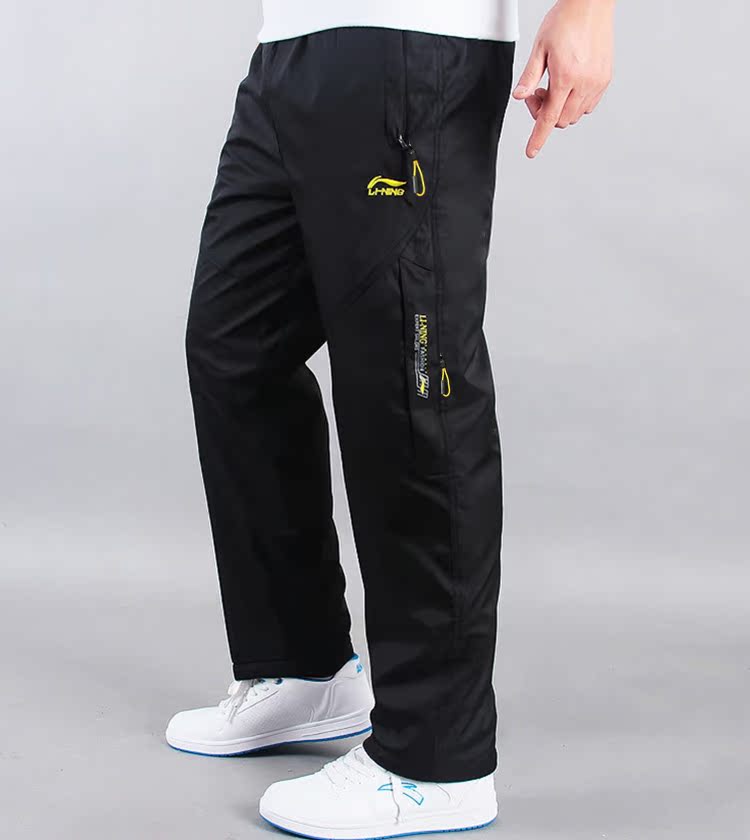 Li Ning mùa đông cộng với quần nhung nam rộng rãi dày ấm áp áo gió mưa lụa nam thể thao quần dài quần áo nam hàng hiệu
