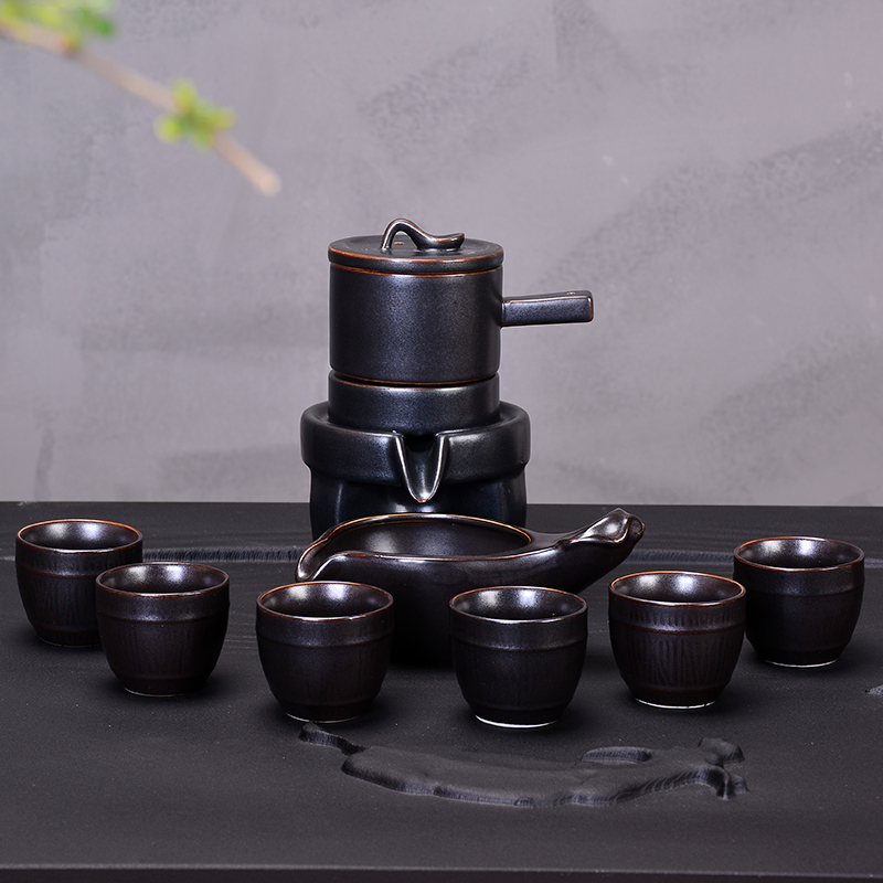 Ancient stone mill all semi - automatic kung fu tea set suit household ceramics lazy people make tea, the teapot cup fortunes