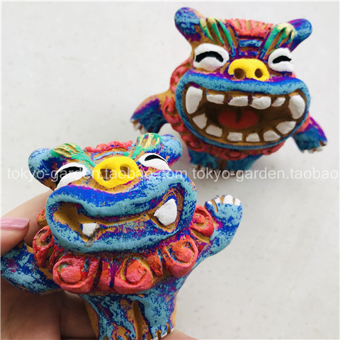 World travel commemorates Japan's Okinawa Ryukyu peninsula back to the wind lion lord Little Lion has a big swing against the clay