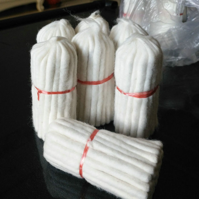 Religious supplies, butter lamps, wicks, large cotton wicks, about 45 each