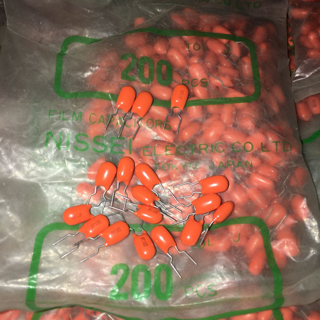 10pcs 5 yuan Nissei Nissei 100V 330P 331J 5% orange metal film audio capacitors