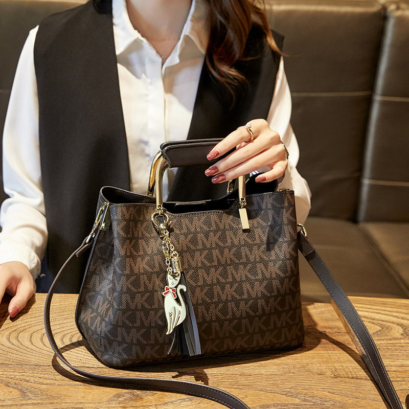 Hong Kong women's bag new fashion printed large capacity bucket bag shoulder handbag Joker messenger bag tide