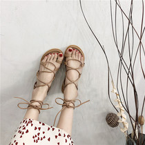 Roman sandals female fairy wind ins tide 2021 new student wild flat flat net red cross strap beach shoes