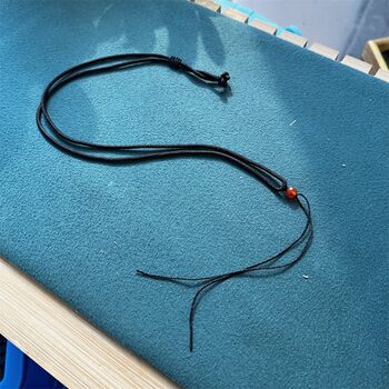 Hand-woven pendant lanyard is adjustable, sturdy and durable
