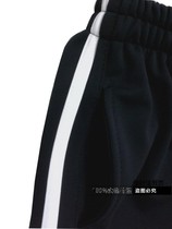 Spring and summer black bar-inlaid white leg pants for boys and girls with loose sports pants
