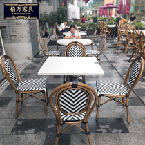 Outdoor rattan chair combination restaurant net red punch garden hotel accommodation outdoor outdoor outdoor French retro leisure tables and chairs